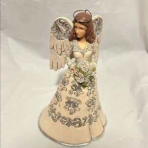 Jim Shore 25th anniversary figurine.